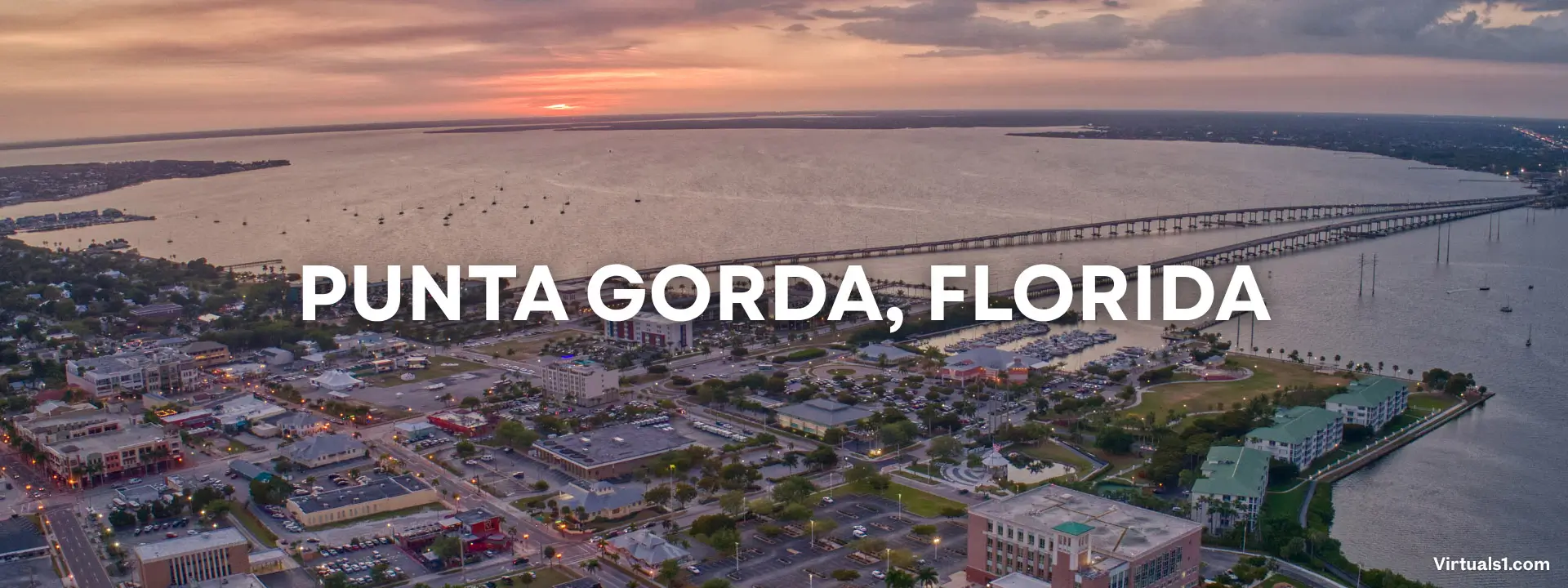 Historic waterfront district in Punta Gorda, FL, with palm trees and a view of Charlotte Harbor, captured by a real estate photographer.